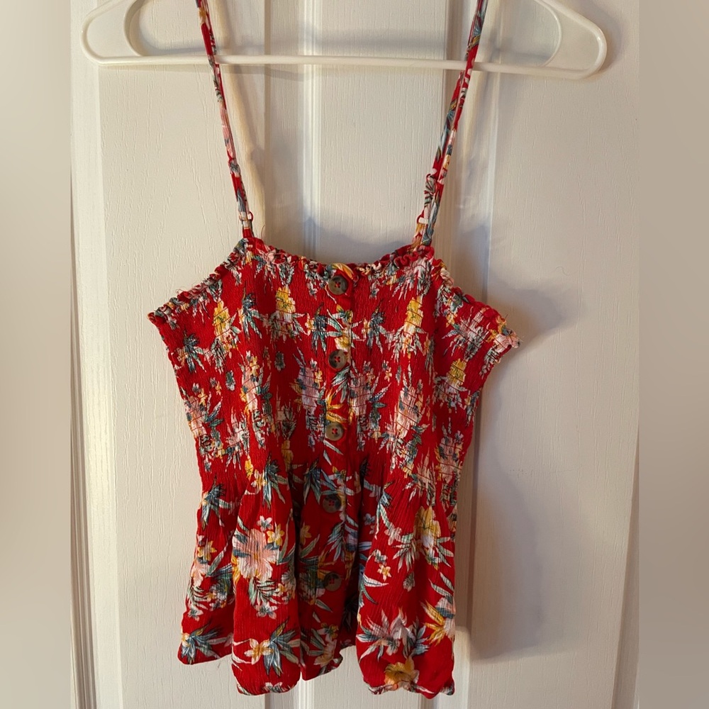 Hawaiian print flowy crop top with adjustable straps!